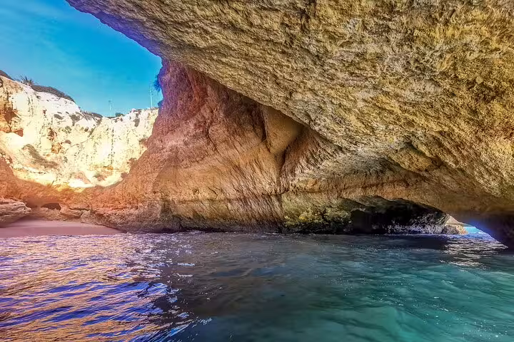 Scenic view from a boat inside the stunning Benagil caves on a private tour from Milfontes to Algarve, Portugal.