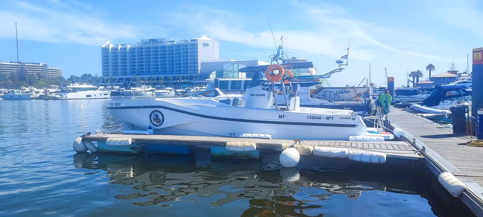 Modern speedboat for Benagil & Dolphins Tour docked at Vilamoura Marina in Algarve Portugal on a sunny day