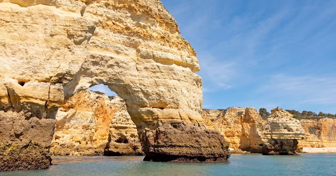 Dramatic limestone arch and coastal cliffs of Benagil Algarve seen from the water on a one hour classic cave boat tour