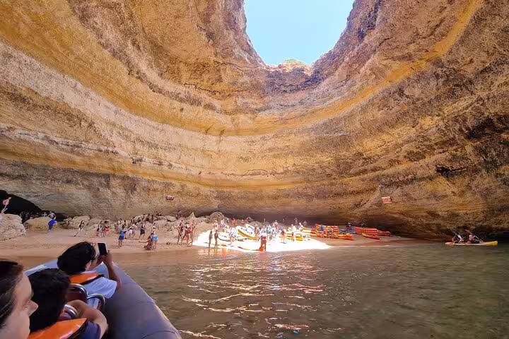 Benagil Sea Cave interior with boats and beach, Algarve stop on all-inclusive private tour from Lisbon