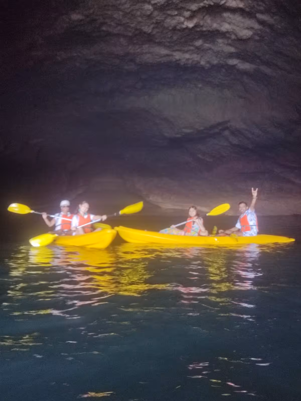 Couples kayaking inside Benagil sea cave, Algarve Portugal, on guided Benagil kayak rental adventure