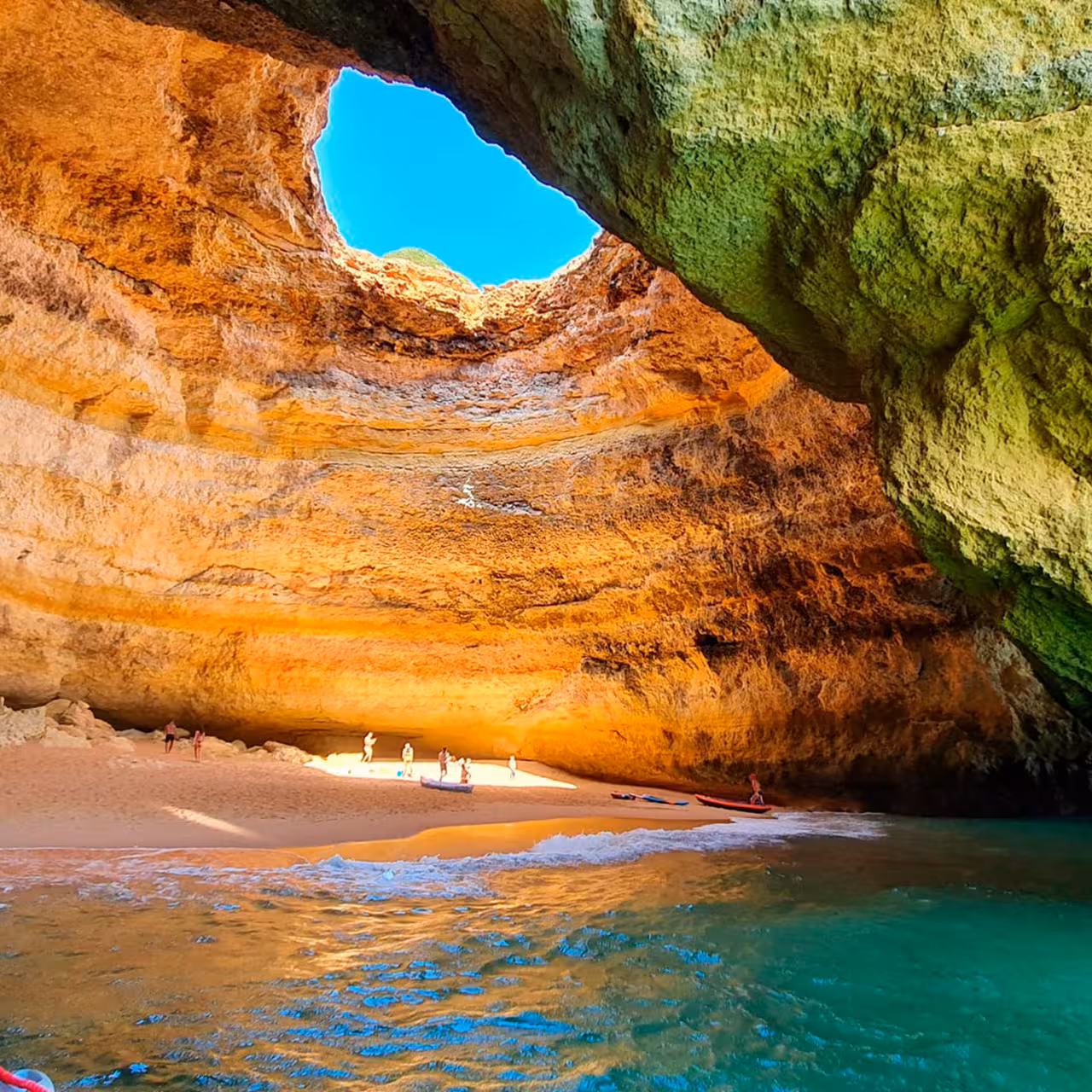 Inside Benagil Sea Cave with skylight and sandy beach, Algarve Portugal, on guided Benagil kayak tour
