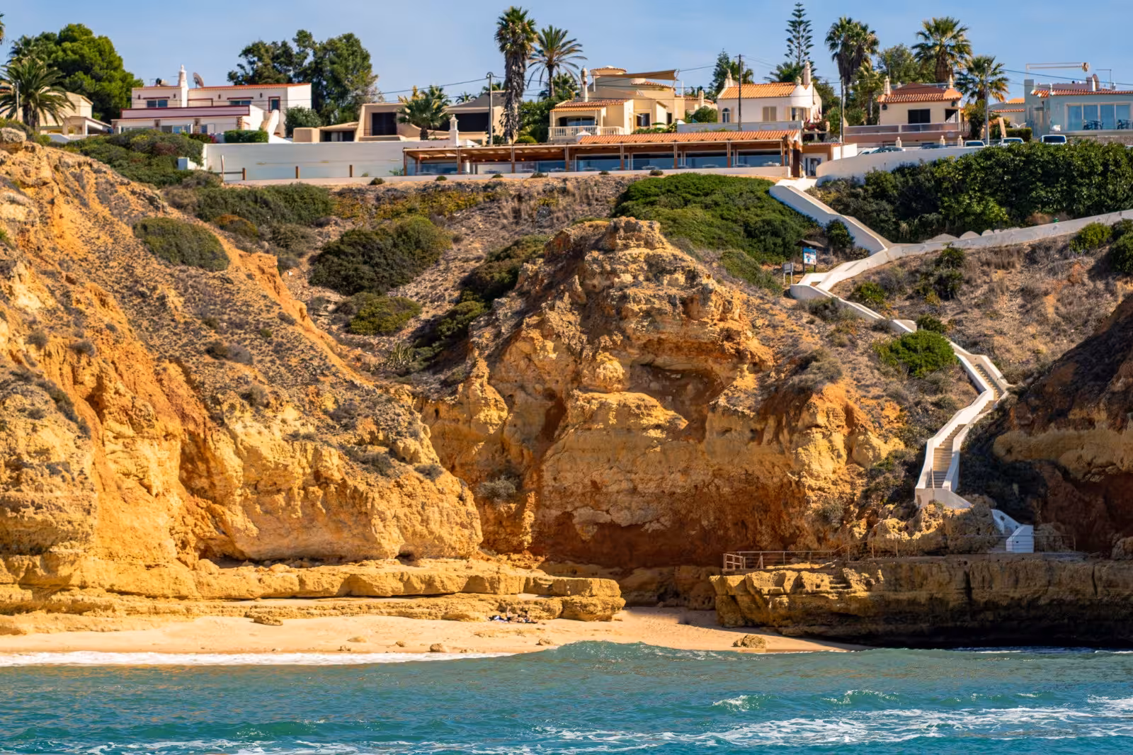 Scenic view of golden cliffs and beach on the Benagil tour route from Portimão, Algarve, Portugal.