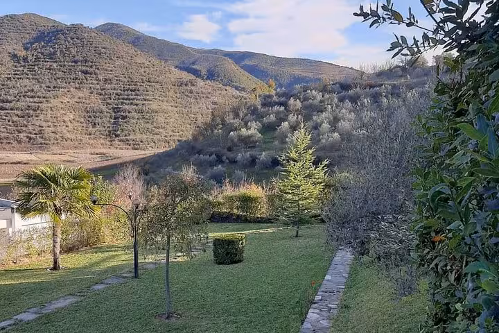 Scenic view of Berat's lush vineyards and rolling hills, ideal for a 4x4 off-road vineyard wine tasting adventure.