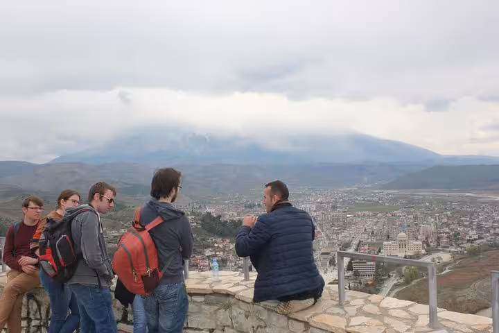 Visitors enjoy a panoramic view of Berat city from a scenic lookout point during the city tour.