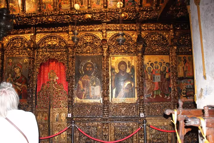 Intricately carved wooden altar with religious icons in a historic church in Berat, ideal for cultural exploration.