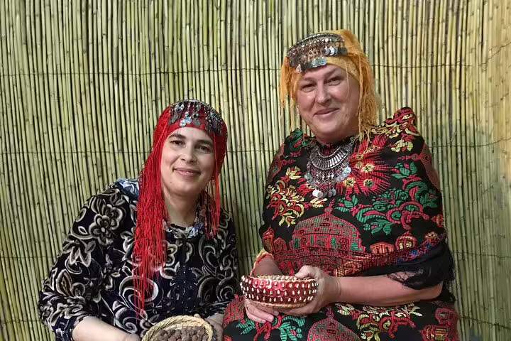 Berber women in traditional Amazigh dress during Ourika Valley cultural tour near Marrakech, Morocco