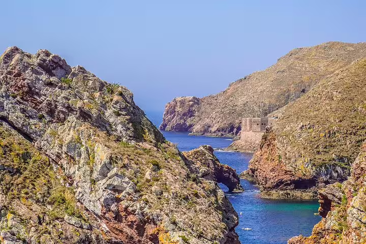 Scenic view of Berlengas Island's rugged cliffs and azure waters on a private full-day tour from Lisbon.