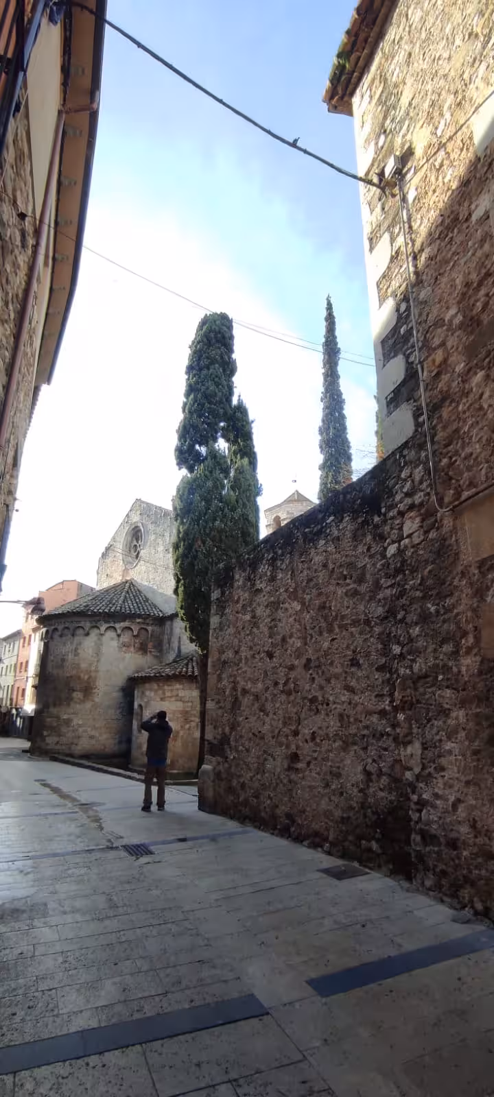 Old stone street by a Romanesque church in Besalú, Garrotxa, on a private guided excursion in Catalonia