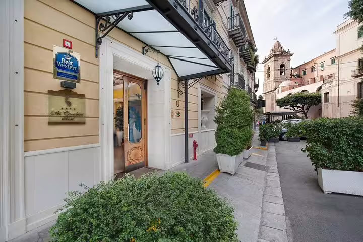 Street entrance of Best Western Ai Cavalieri Hotel in central Palermo, arrival point for private airport transfer service