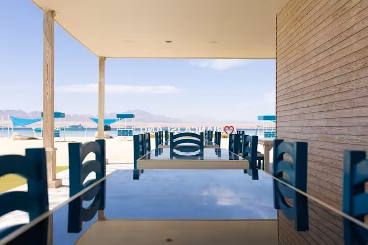 Seafront dining tables at Bianca Island Utopia near Hurghada, day tour with hotel transfer and lunch included