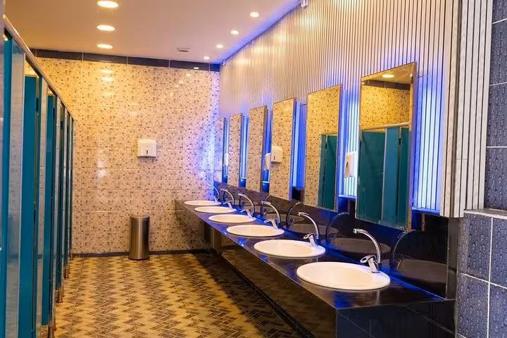 Clean modern washroom with sinks and mirrors at Bianca Island on Utopia Island tour from Hurghada
