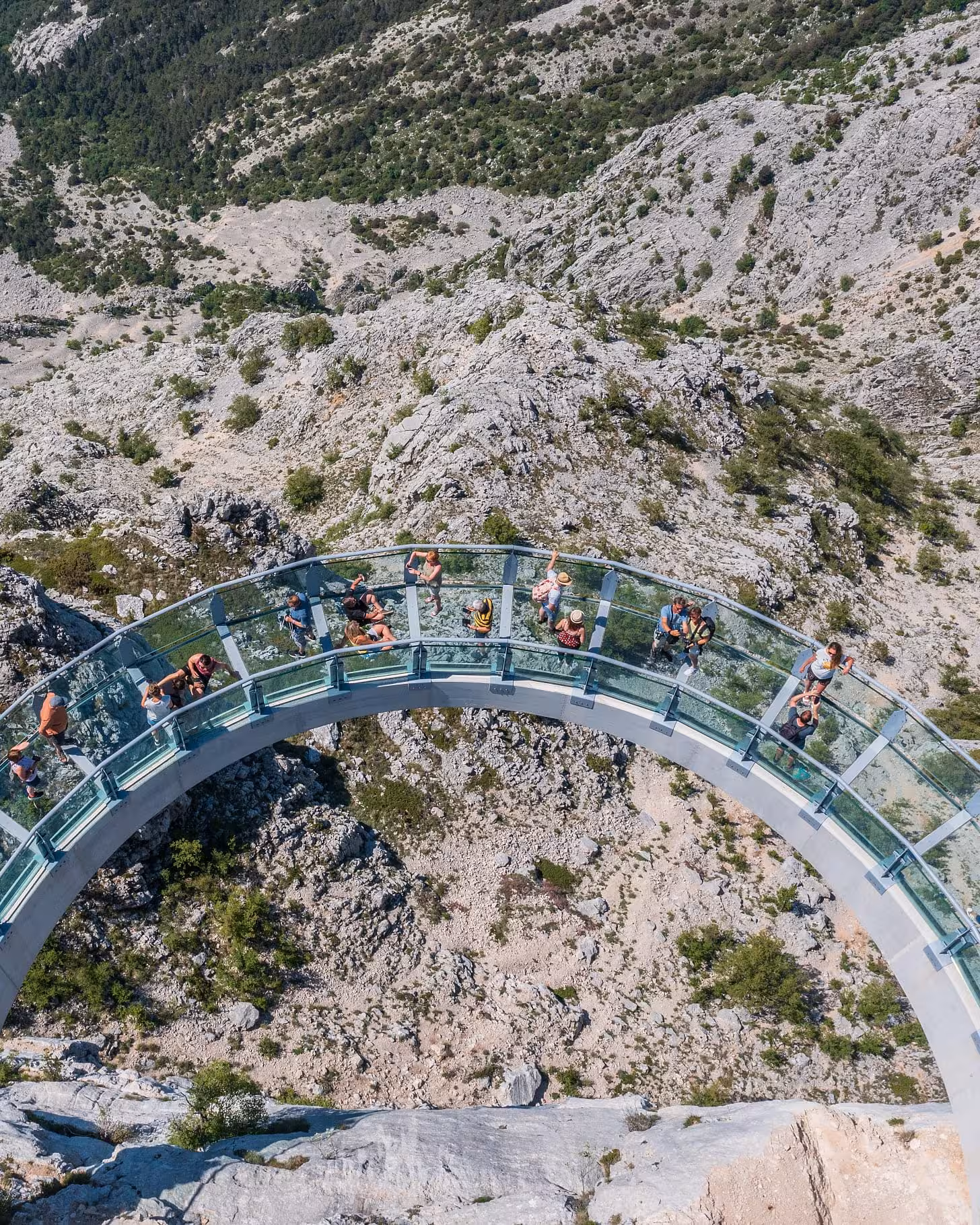 Top-down view of Biokovo Skywalk glass platform over cliffs, Makarska adventure day trip from Split