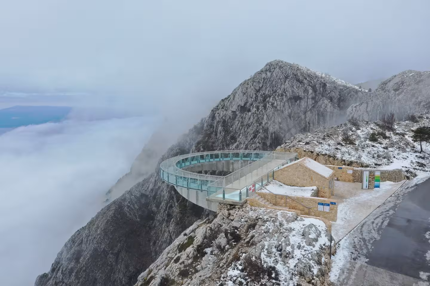 Snowy Biokovo Skywalk near Makarska in winter fog, dramatic cliffview stop on Split to Skyline adventure