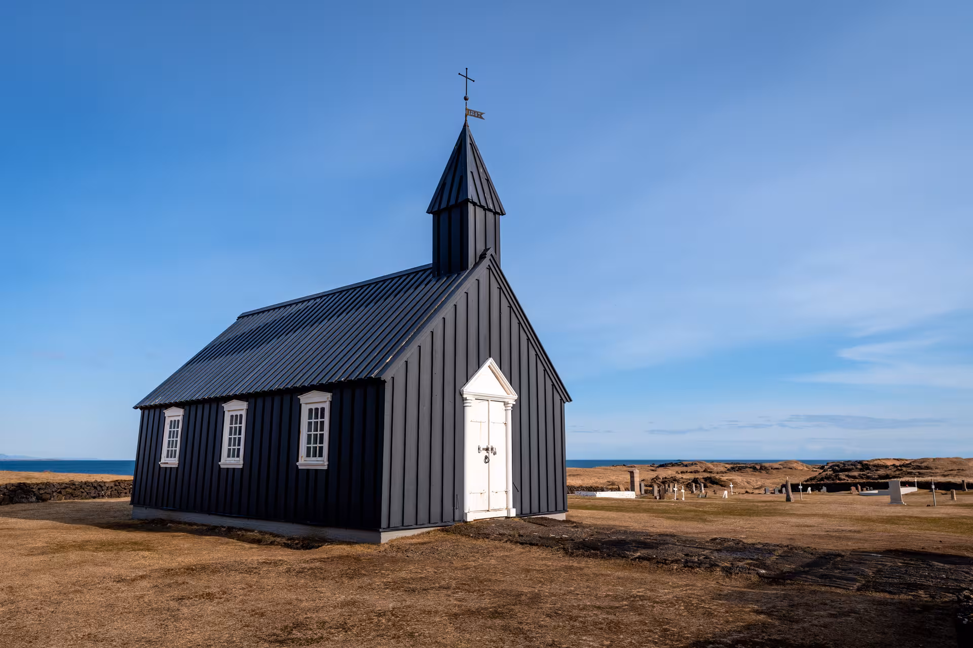 Historic black church under clear skies on Snæfellsnes Peninsula, a must-see on the private day tour.