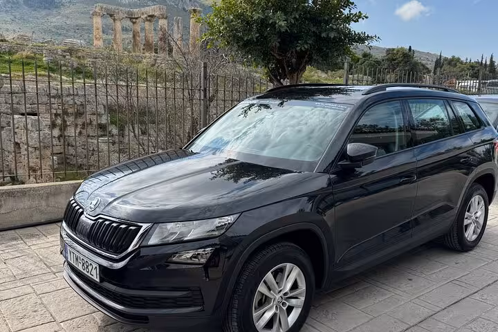 Black luxury SUV for Athens hotel to Athens Airport private transfer parked near ancient ruins in Athens