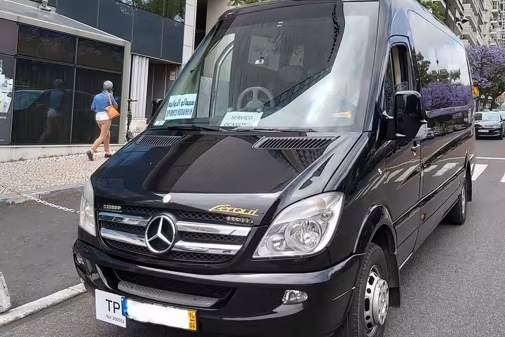Black minibus for Lisbon airport shuttle transfer, reliable pickup from Lisbon Airport to Lisbon city hotels and return