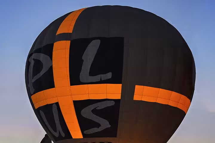 Close-up of black and orange hot air balloon envelope before sunrise on Cappadocia balloon tour