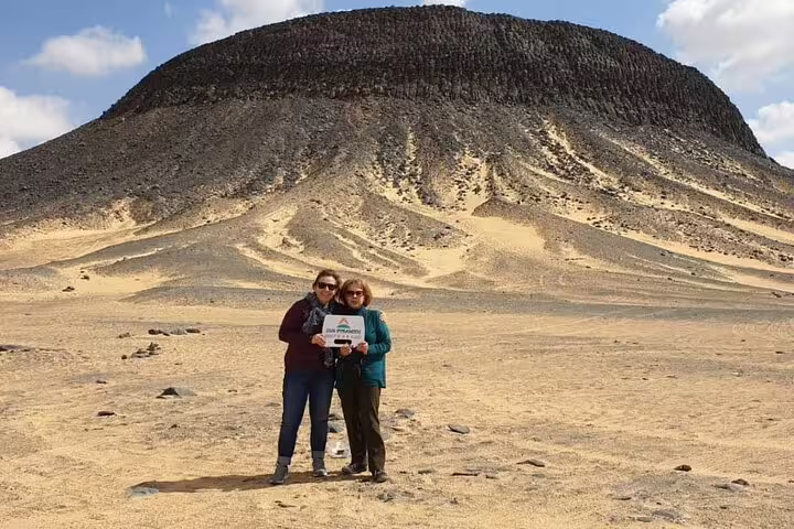 Friends pose in Egypt White Desert on a 2-day Black & White Desert jeep safari with camping adventure