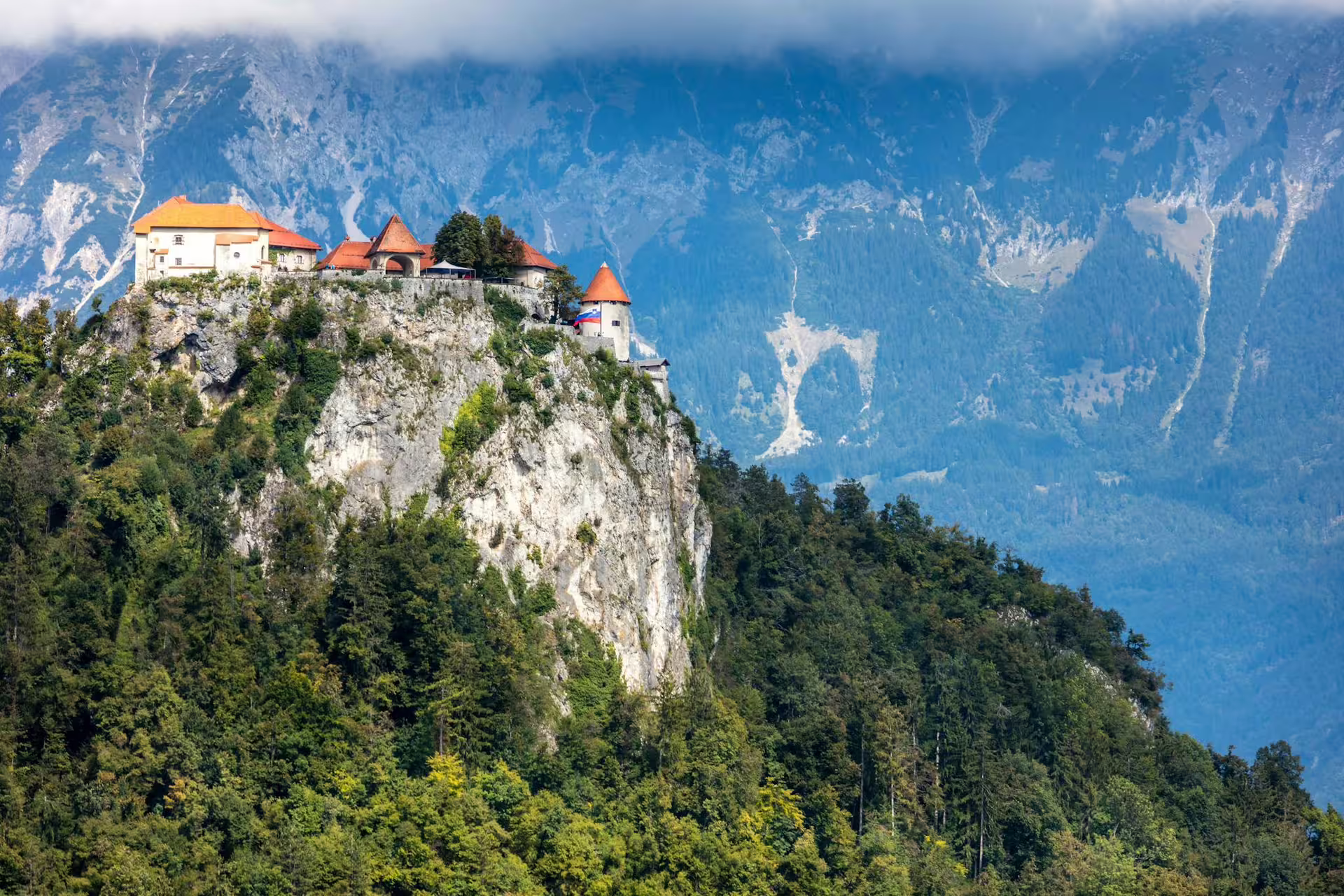 Bled Castle perched on a cliff above Lake Bled, Slovenia, a highlight of the summer guided tour