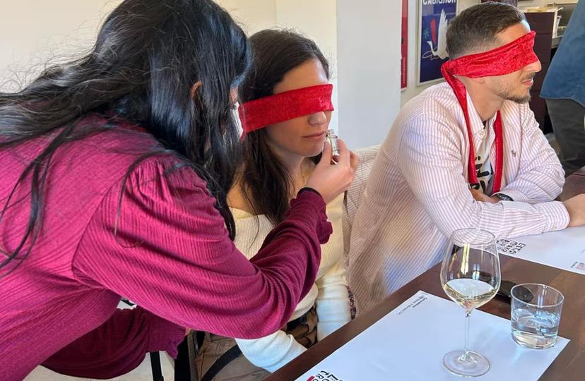 Participants blindfolded during an interactive wine tasting session in Marsala, enhancing sensory exploration.