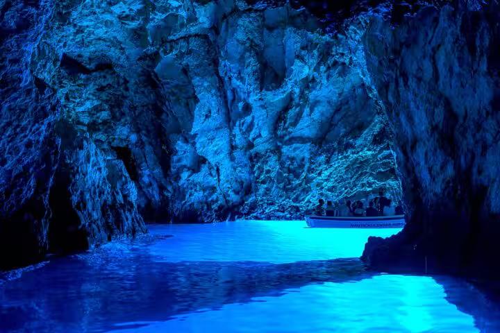 Boat inside the glowing Blue Cave on Biševo during Hvar Vis and Pakleni Islands group speedboat tour
