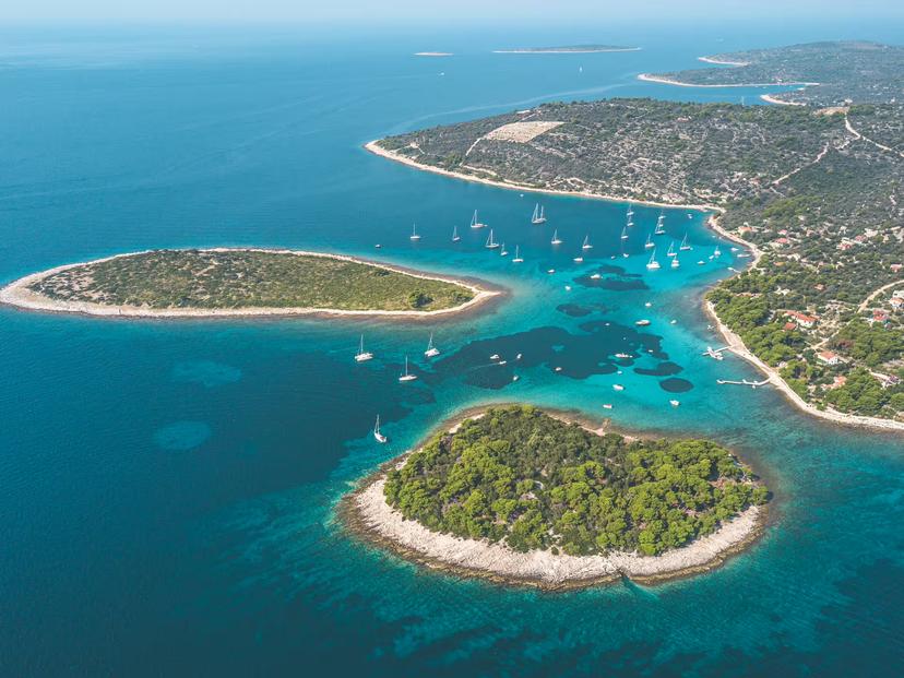 Aerial view of Blue Lagoon Croatia with anchored boats near Drvenik and Čiovo, highlight of half-day boat tour from Split