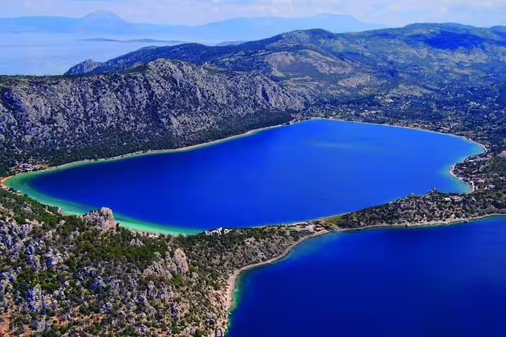 Aerial view of Blue Lagoon Greece with turquoise shoreline and mountains, stop on a private tour from Athens