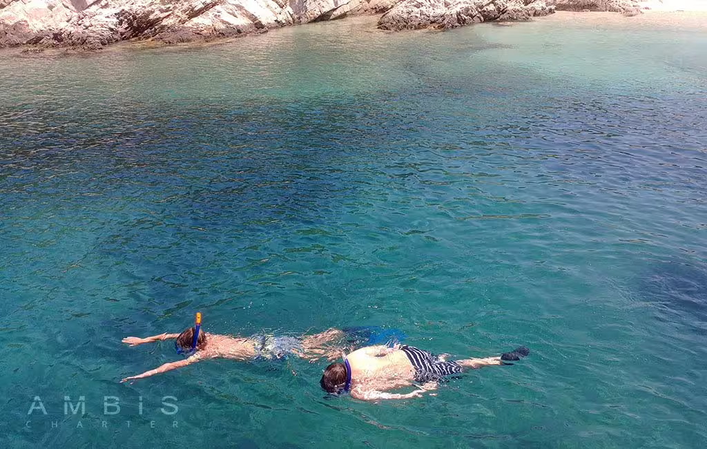 Snorkeling in crystal-clear Blue Lagoon waters near Čiovo on a half-day boat tour to Blue Lagoon, Šolta and Čiovo