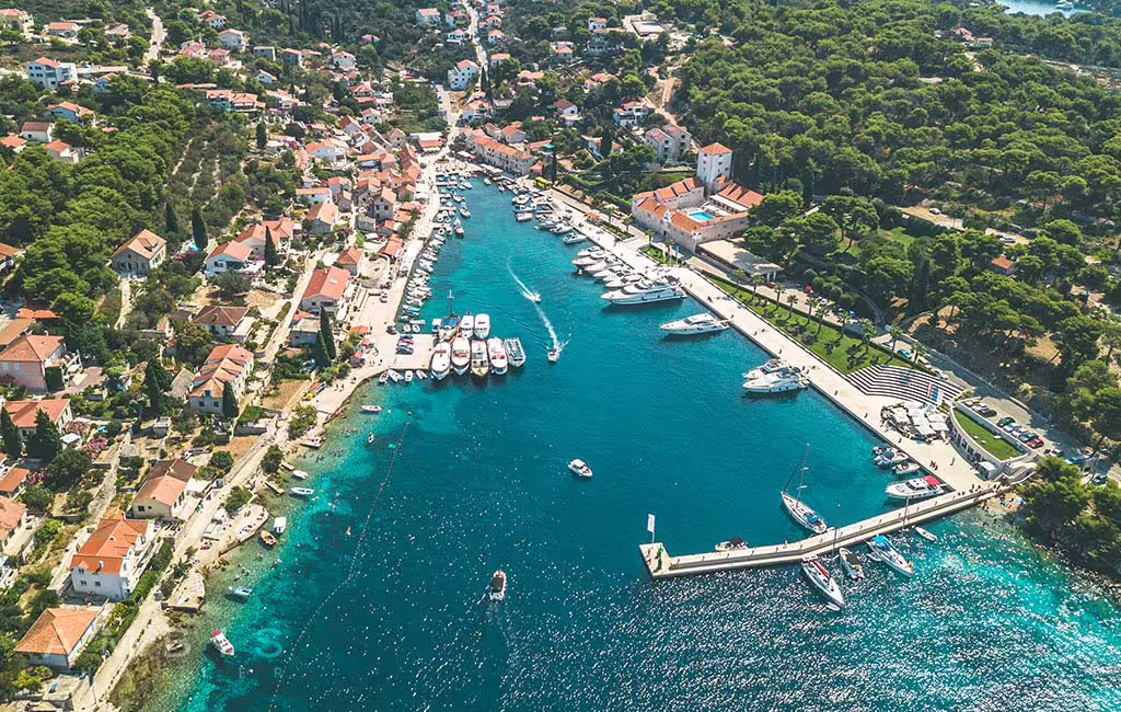 Aerial view of Šolta island marina with turquoise bay and boats, Blue Lagoon private tour from Split