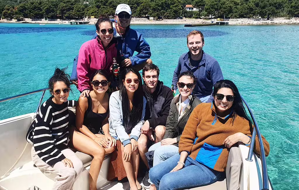 Group relaxing on speedboat in turquoise Blue Lagoon on private Blue Lagoon & Šolta island tour from Split