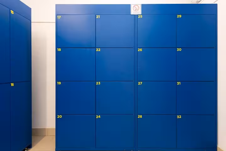 Organize your belongings with ease in our modern blue lockers, ideal for safe luggage storage in Rome.