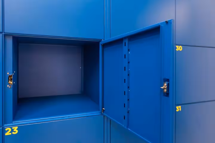 Close-up of open blue locker in Rome storage facility, showcasing secure and spacious luggage storage options.