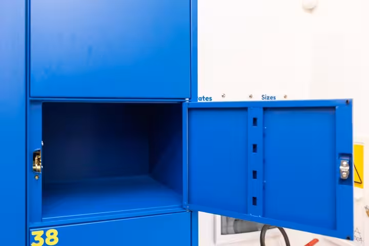 Spacious blue locker open for secure luggage storage in Rome, ideal for travelers seeking convenient bag storage solutions.