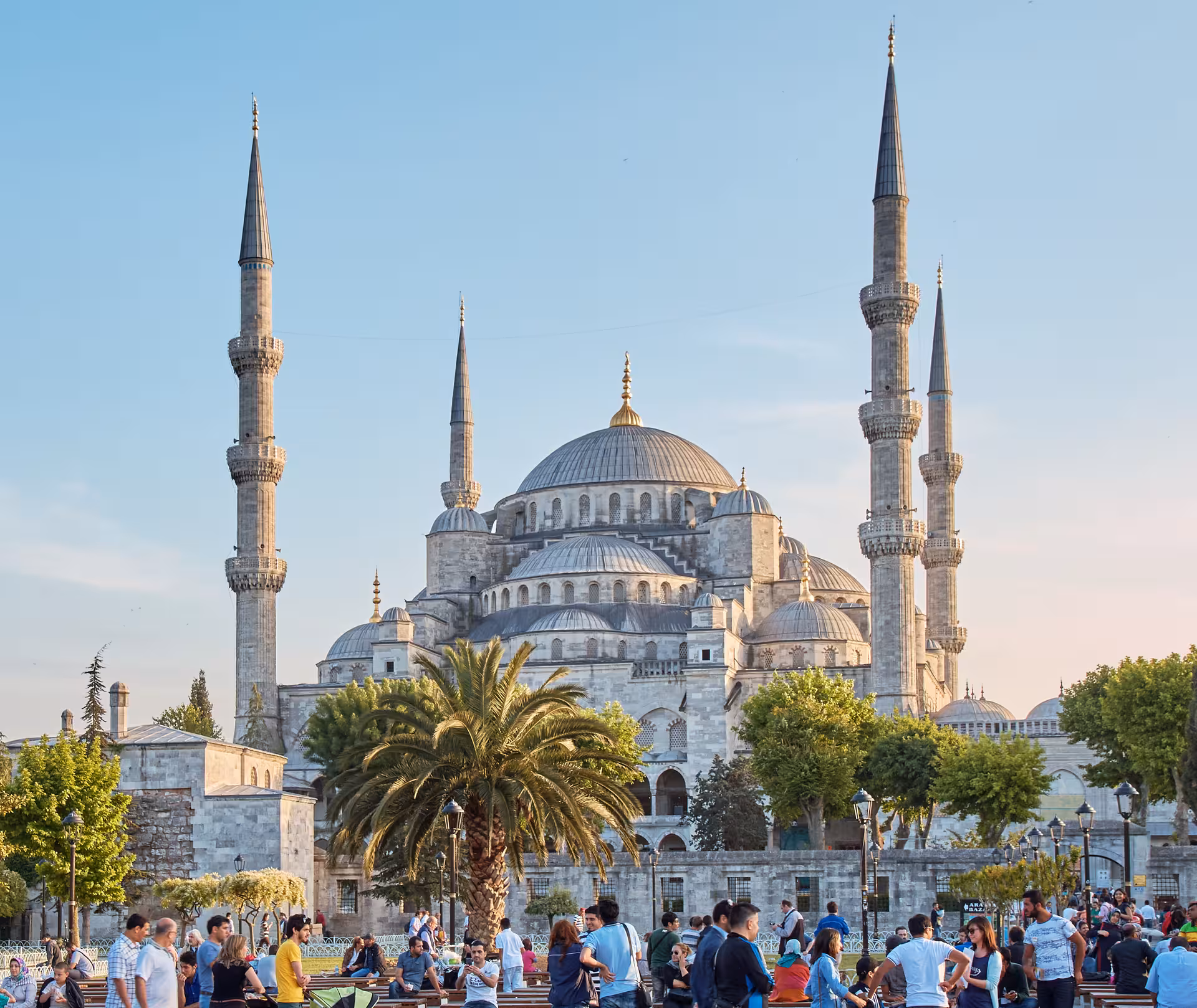 Blue Mosque in Istanbul at sunset with lively Sultanahmet Square, featured in 5-day Turkey package