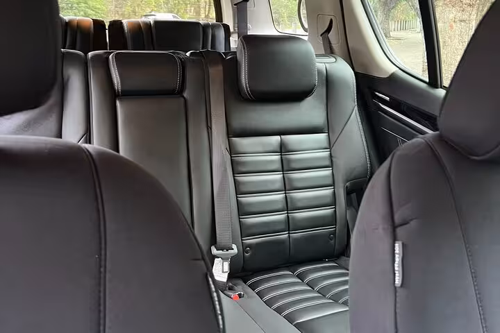 Spacious interior of luxury vehicle used for Blue Mountains private group tours, offering comfort and style.