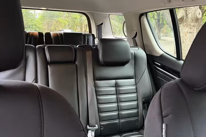Luxurious interior of SUV featuring plush black leather seats, perfect for Blue Mountains winery tour comfort.