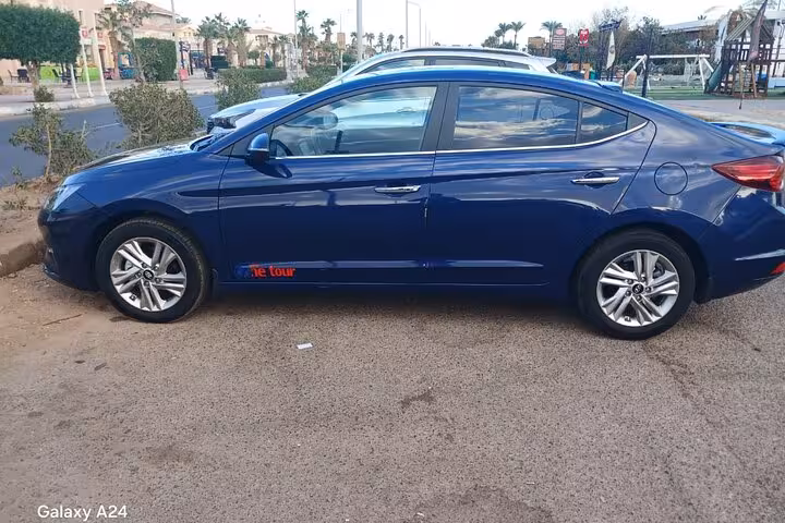 Blue sedan private transfer vehicle in Sharm El Sheikh for hotel pickup and drop-off to any destination