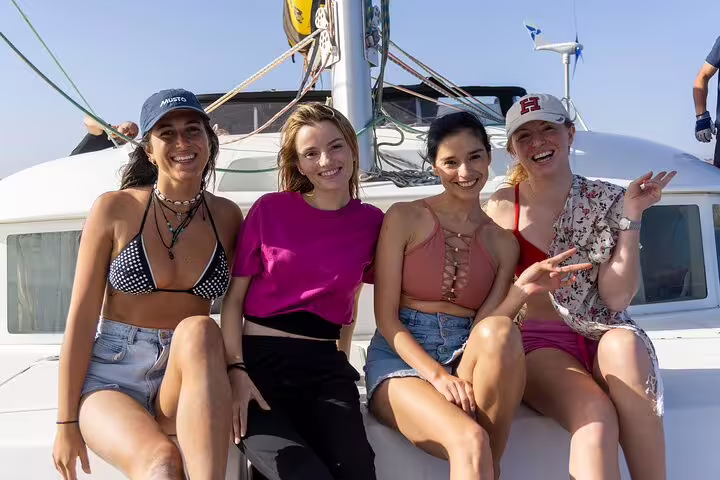 Group of friends relaxing on a boat, experiencing the ultimate Boa Vista adventure tour.
