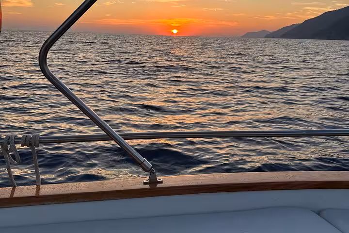 Breathtaking sunset over the Ligurian Sea from a boat deck during the La Spezia to Portovenere tour.