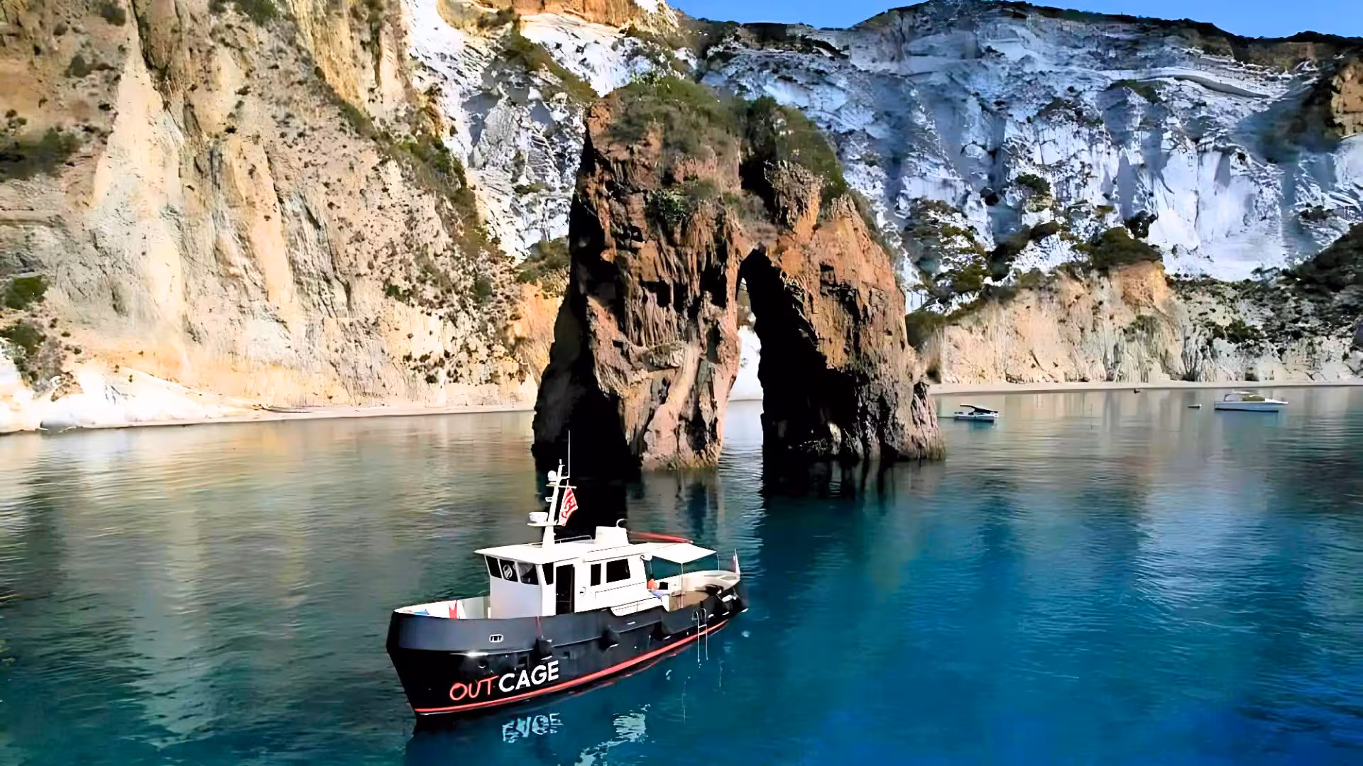 Scenic boat tour near dramatic rocky cliffs on Tavolara Island, highlighting marine adventure from Golfo Aranci.