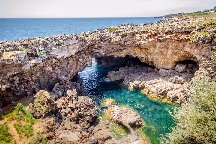 Scenic view of Boca do Inferno rock formation with turquoise waters in Cascais.