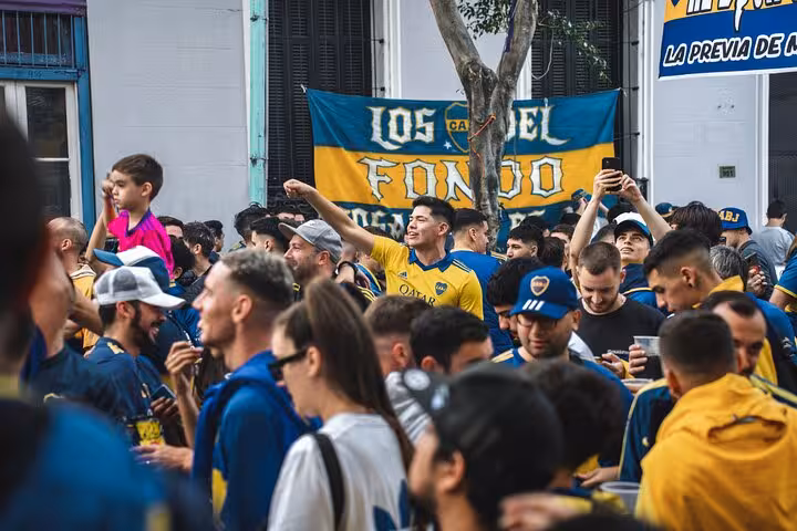 Boca Juniors fans in La Boca before the match, joining local pregame atmosphere near La Bombonera