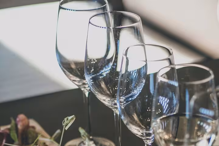 Elegant wine glasses set for tasting experience at Bogove's Splendor, highlighting the tour's luxurious wine adventure.