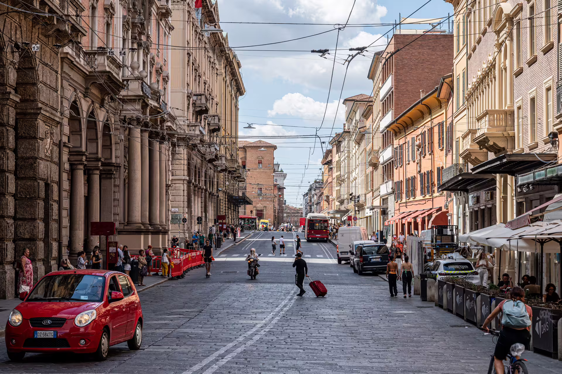 Bologna historic street scene on self-guided 1-day walking tour with audioguide, buses and arcades