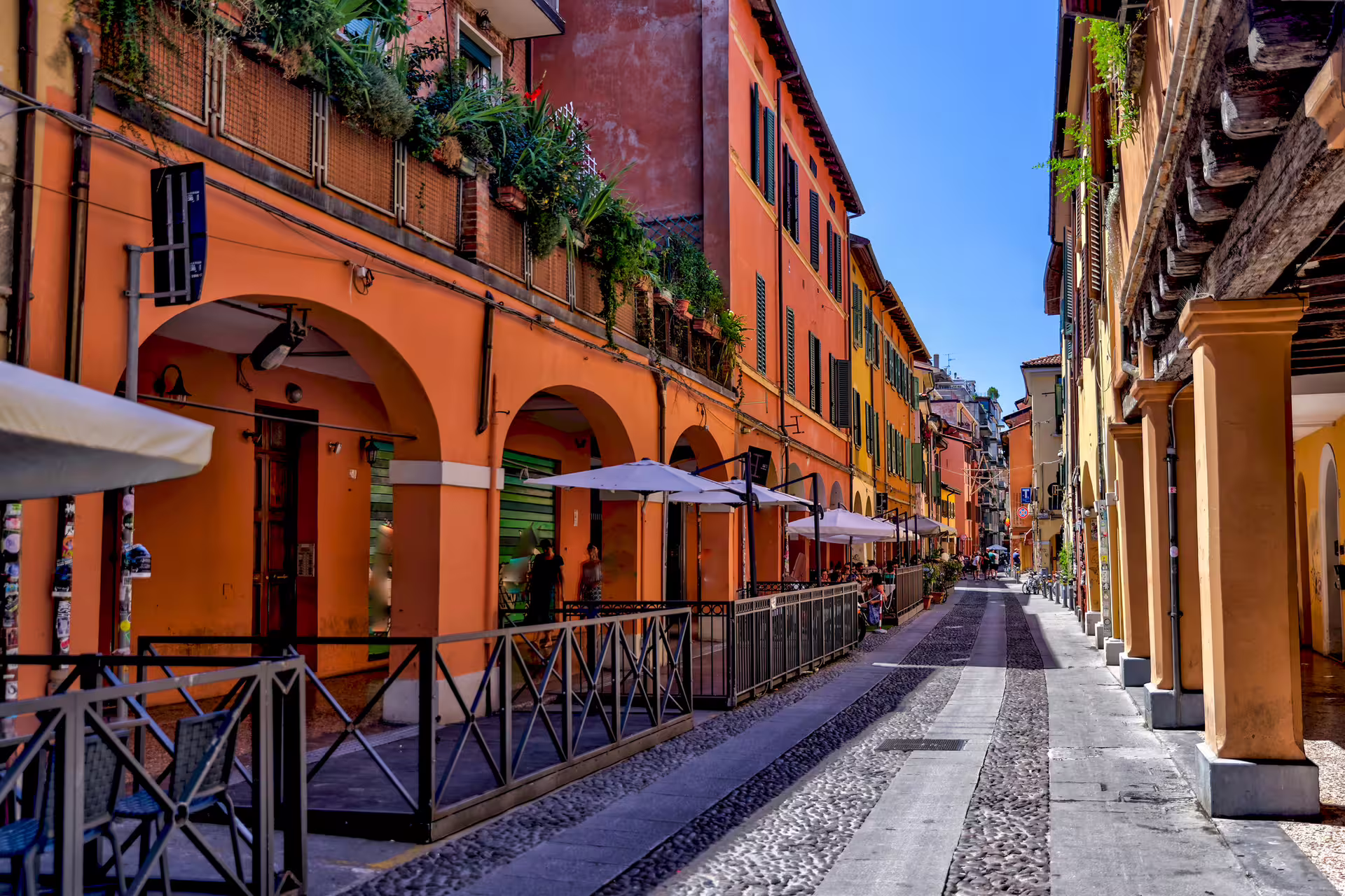 Colorful portico street in Bologna historic center, seen on 1-day self-guided walking tour with audioguide