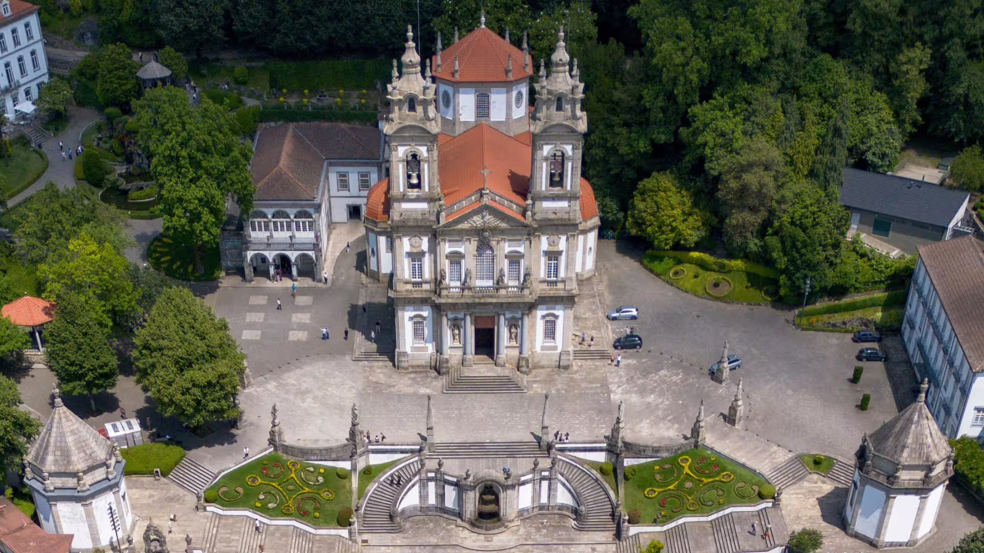 Aerial view of Bom Jesus do Monte Sanctuary in Braga, showcasing its iconic baroque architecture and lush gardens.