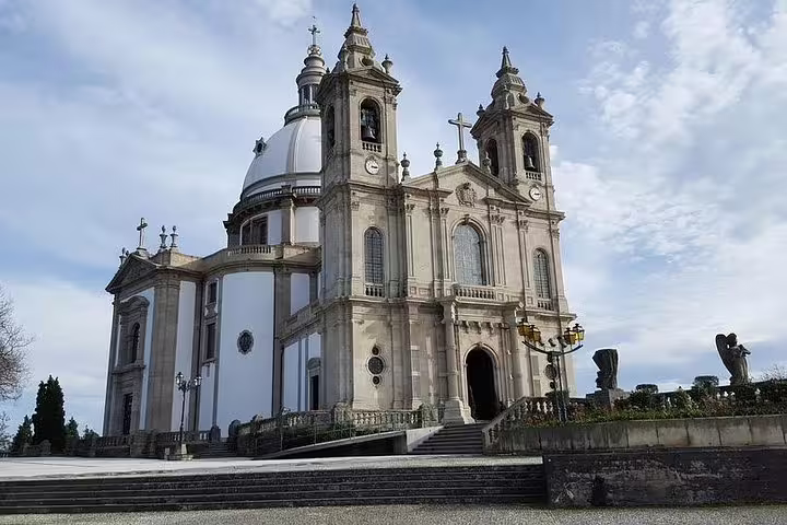 View of the Bom Jesus do Monte Sanctuary, a stunning neoclassical church in Braga, Portugal, ideal for cultural tours.