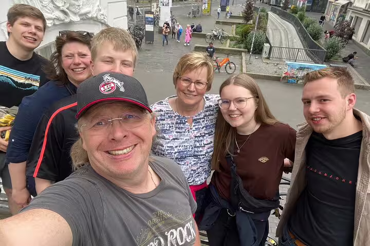 Group selfie during the Bonn scavenger hunt and sights self-guided tour in the city center streets