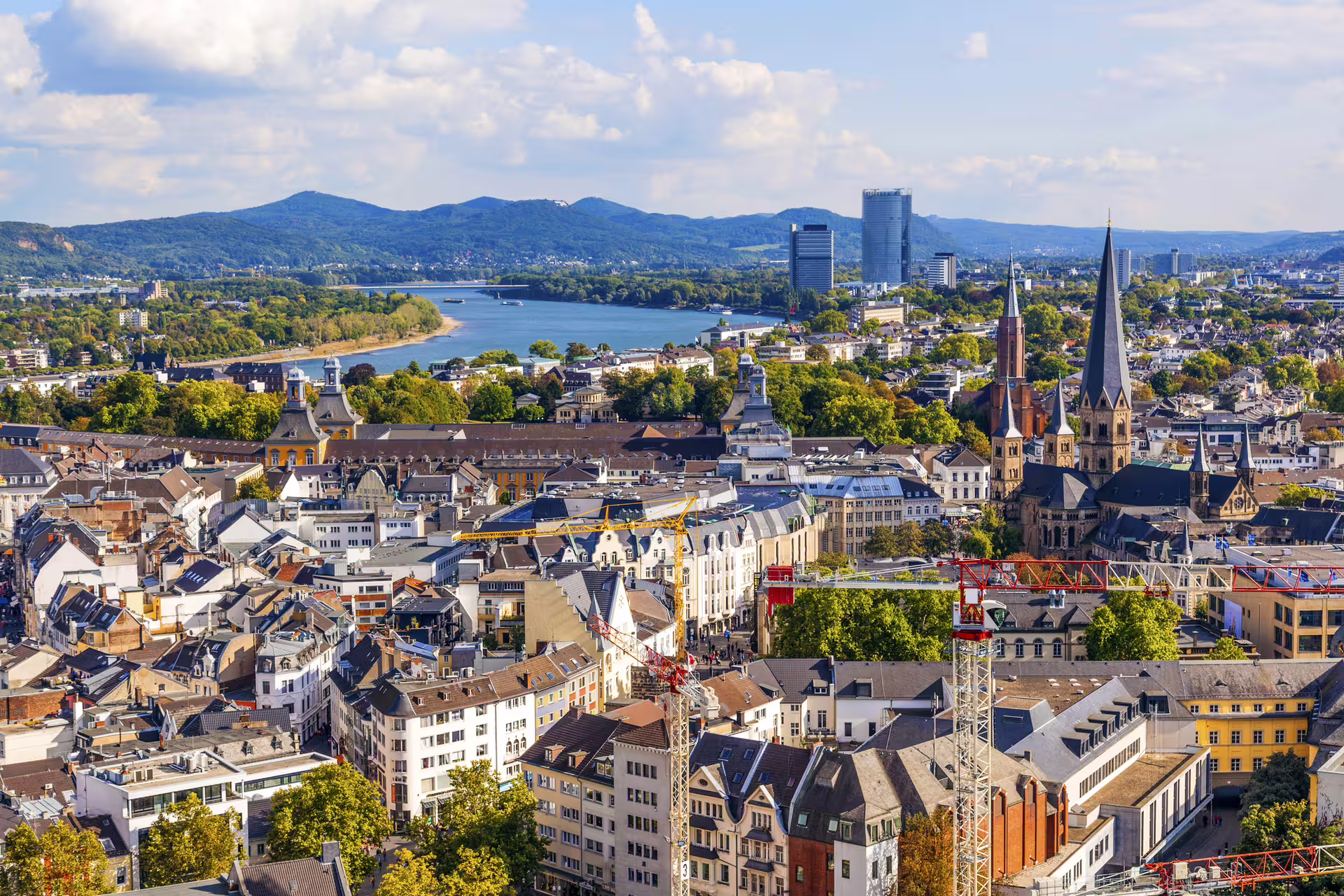 Panoramic Bonn skyline with Rhine River and Minster spires, ideal for Bonn in 1 day walking tour audioguide